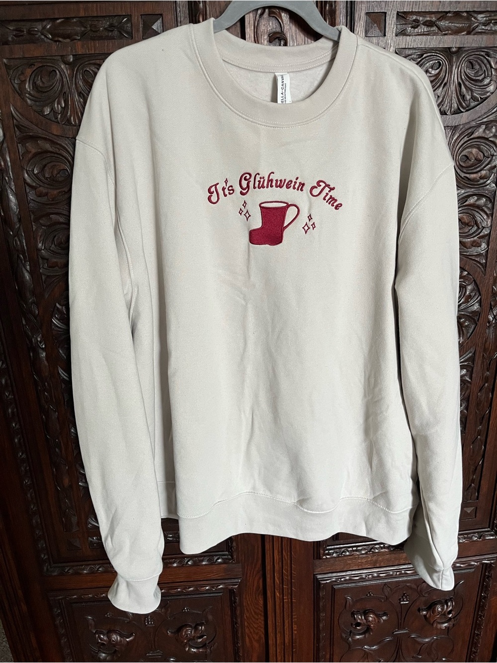 BellaCanvas Cream Sweatshirt with Red 'It's Glühwein Time' Graphic